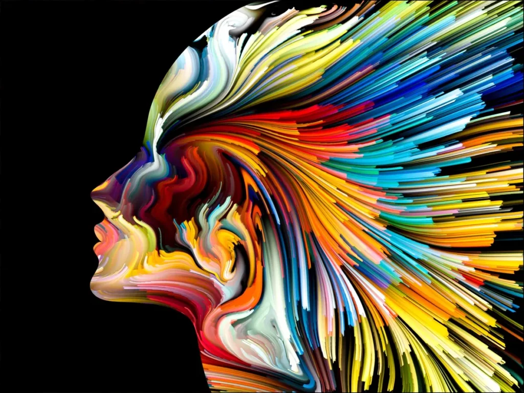 A colorful painting of a woman 's face.