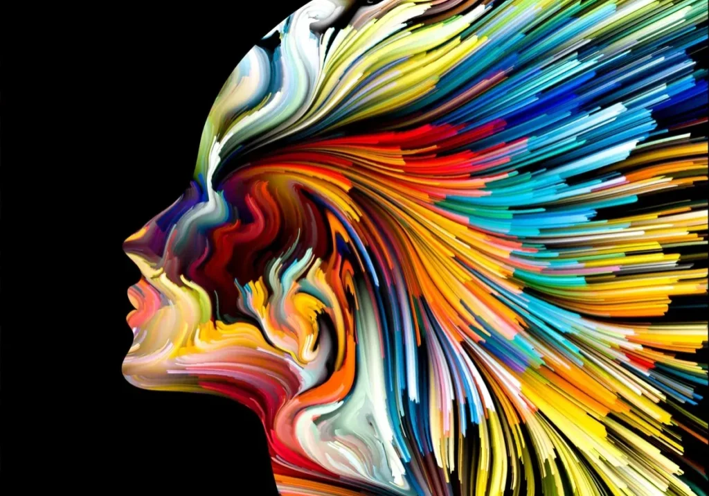 A colorful painting of a woman 's face.